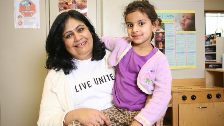 mother holding little girl in a doctor office