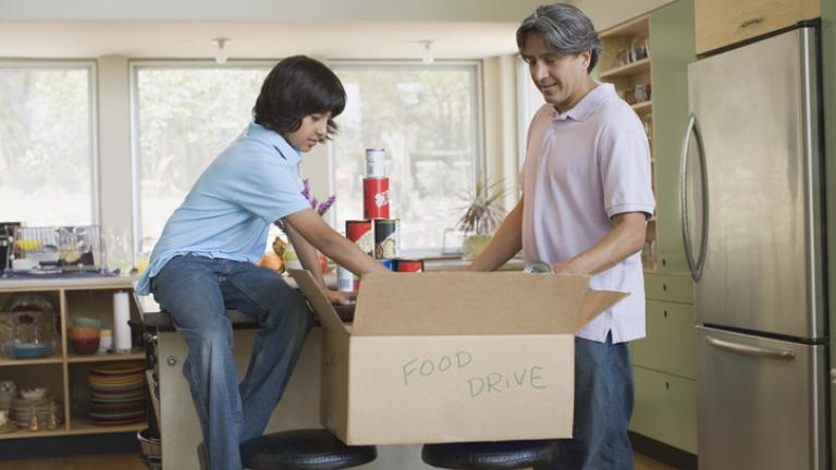 father and son food volunteering